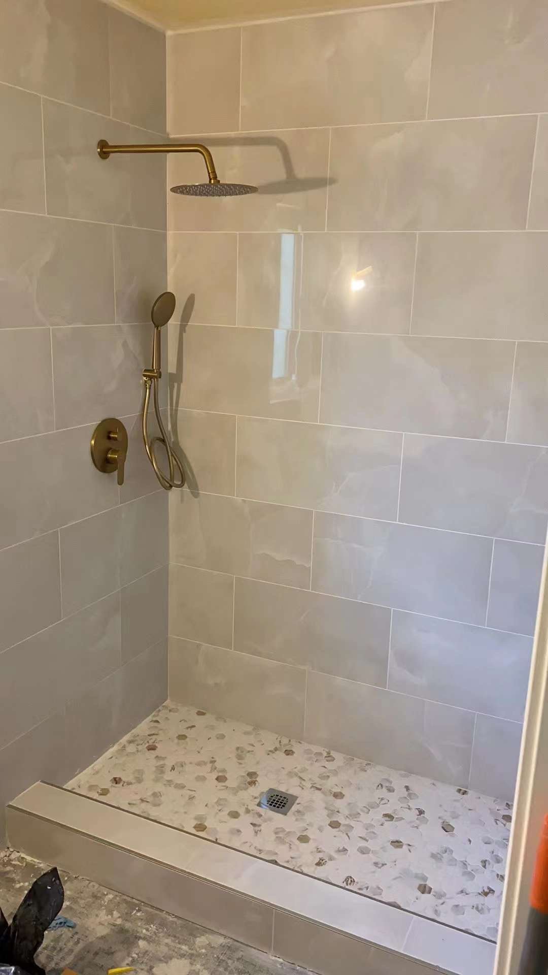 Modern Bathroom — Gold Fixtures & Oversized Tiles